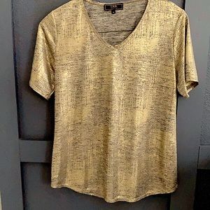 Women’s short sleeve shimmery top.